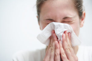 Woman Blowing Nose Tissue