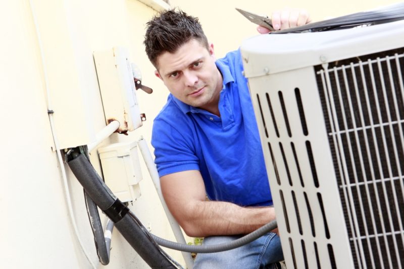 Man Checking Air Conditioner AC