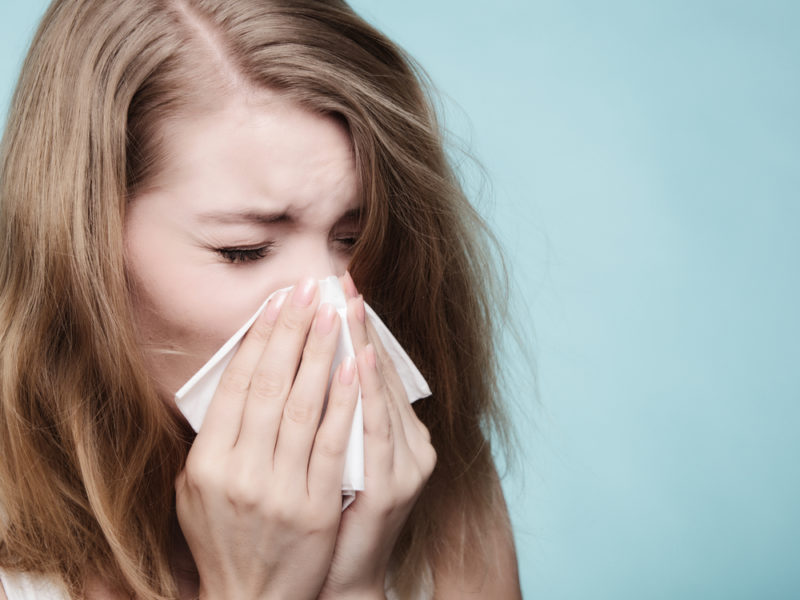 Woman Blowing Nose Allergies